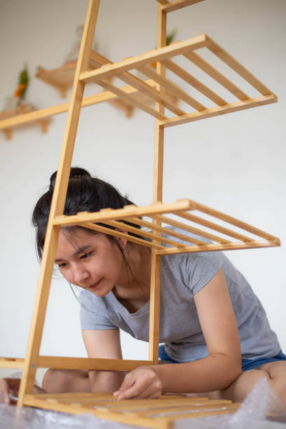 istock Asian woman is assembling the drying rack 1392773095