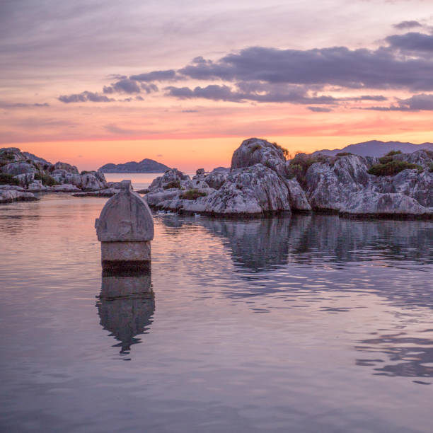 Calm bay reflects scene and island
