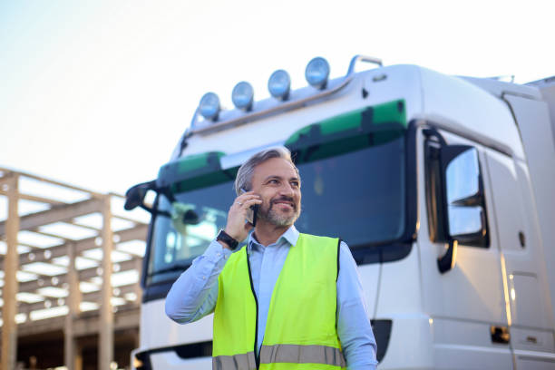 Truck driver talking on phone stock photo