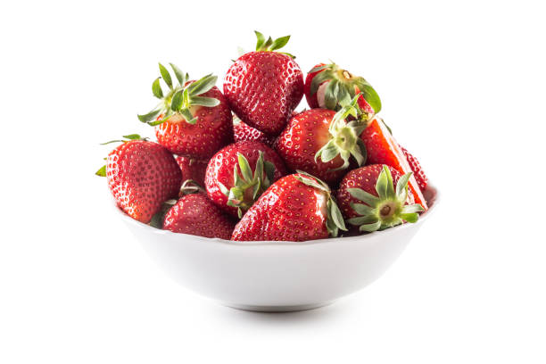 istock Fresh strawberries in a bowl on a white isolated background. 1392775783