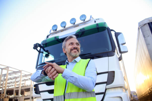 istock Truck driver checking the time 1392775786