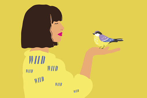 Illustration of a young woman holding little bird in hand on yellow background, side view. Concept of beauty and fauna