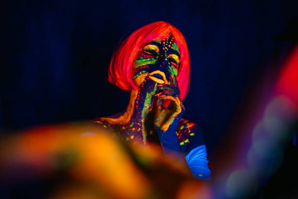 istock Young Woman With Fluorescent Makeup 1392778899
