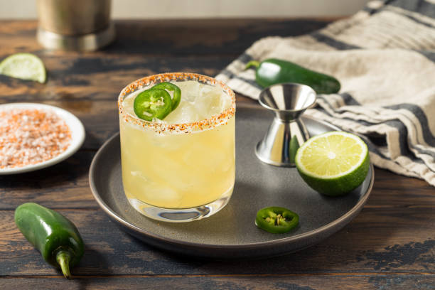 Boozy Spicy Jalapeno Margarita Boozy Spicy Jalapeno Margarita with Tequila and Lime margarita stock pictures, royalty-free photos & images