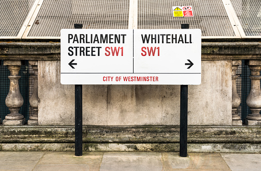 London, UK - A street sign for Parliament Street and Whitehall, two streets in the heart of Westminster.