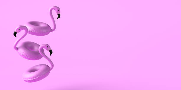 istock Summer concept with flamingo floats floating on pink background. Copy space. 3D illustration. 1392788335
