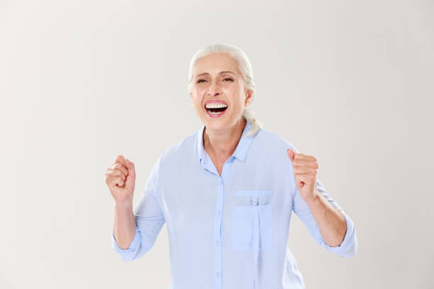 istock Overjoyed old woman, celebrating the vin 1392790380