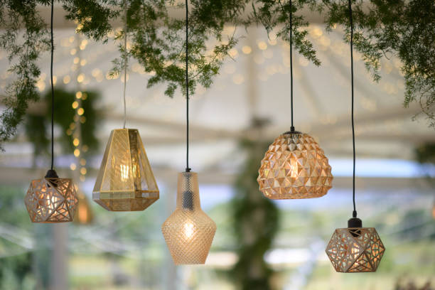 istock Various golden shining illuminated lounge lights hanging together 1392791410