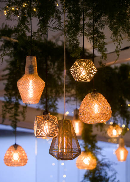 istock Various golden shining illuminated lounge lights hanging together at dusk 1392791462