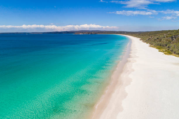 istock Idyllic view of a white sand and clear blue ocean beach 1392794196