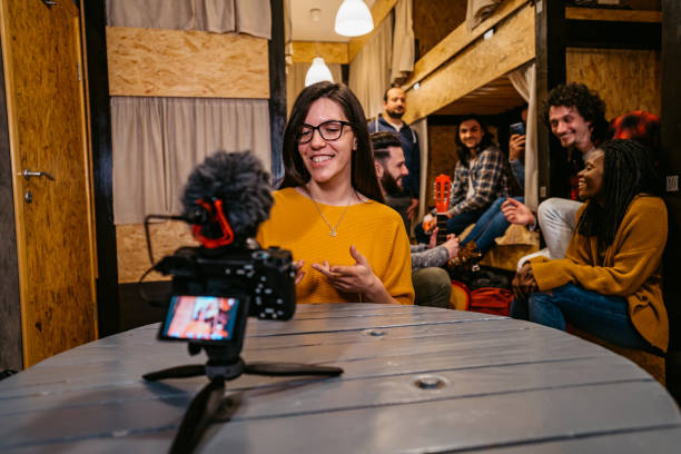 istock Woman vlogging from her hostel room 1392794640