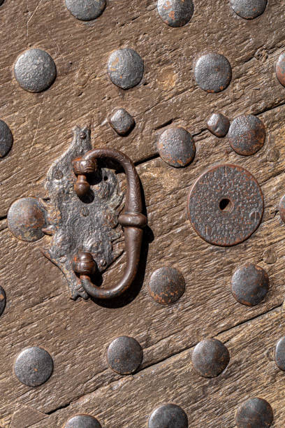 istock Old rusty doorknob and wooden door 1392794762