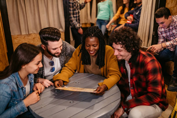 istock Tourists planning their day in hostel 1392794787