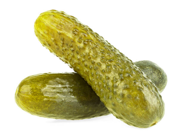 istock Canned cucumbers isolated on a white background. Two pickled cucumbers. 1392796177