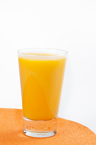 orange juice with oranges isolated on white
