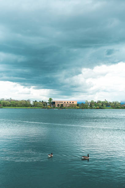 Willen lake under cloudy sky in summer, Milton Keynes