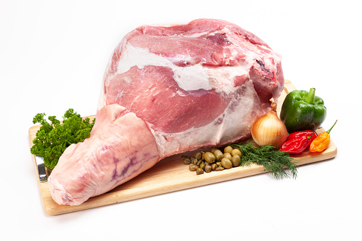 Raw whole Duck meat set with herbs, on white stone table background, with copy space for text
