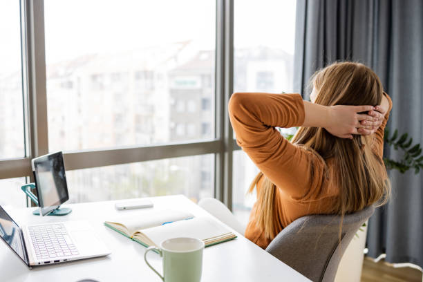 Young woman taking a break from work in the office