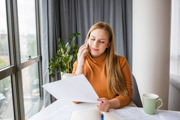 istock Young woman working in home office 1392801295