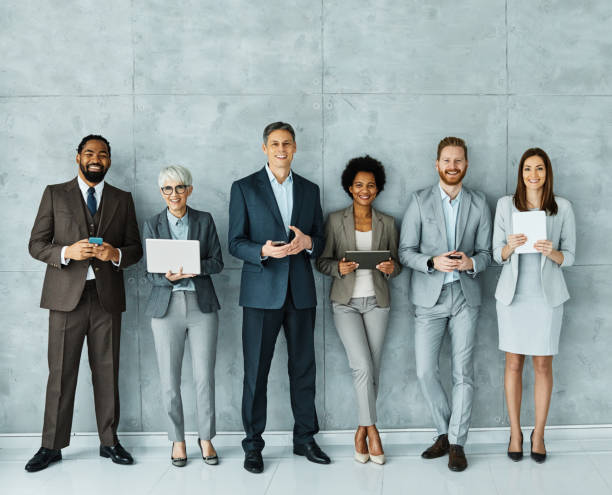 istock young business people meeting office teamwork group network wireless internet tablet smartphone mobile phone connection technology laptop computer together portrait 1392801377
