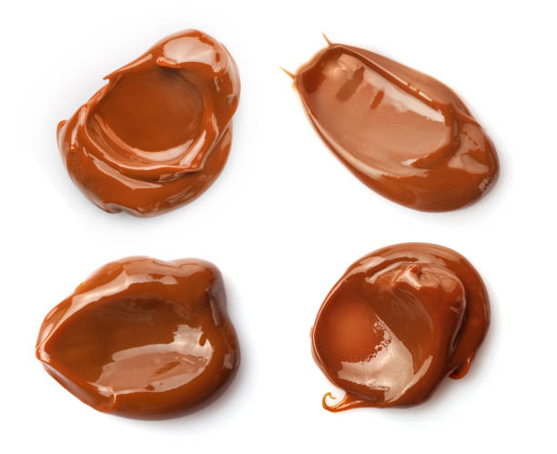 istock Set of melted caramel smears isolated on white background. 1392801441