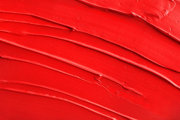 istock Red paint texture. Red lipstick background. Top view 1392801538