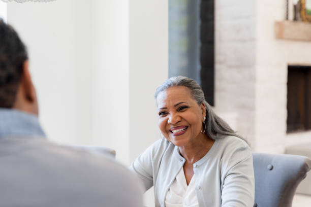 istock Senior wife smiles at unrecognizable husband 1392802389