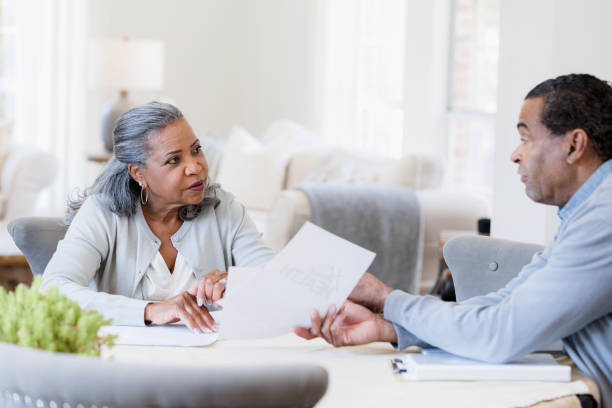 istock Senior couple has serious discussion about healthcare paperwork 1392802409
