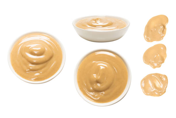 istock Mushroom sauce in a bowl isolated on white background. 1392803749