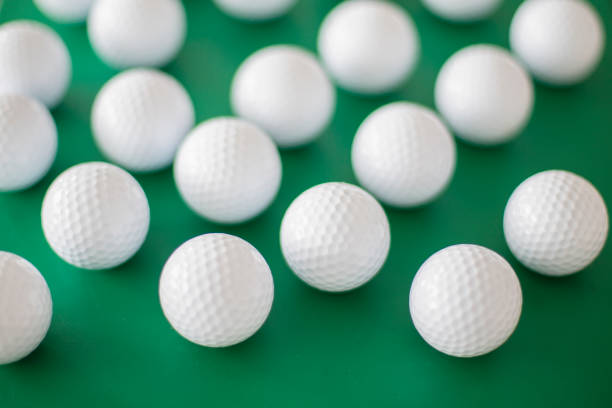 istock Golf balls on the green background 1392805340
