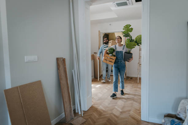 Couple arriving in new home stock photo