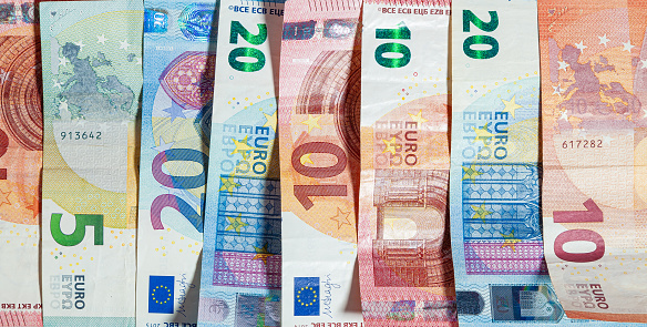 horizontal background of spread out paper euros of different denominations, Euro Money Banknotes