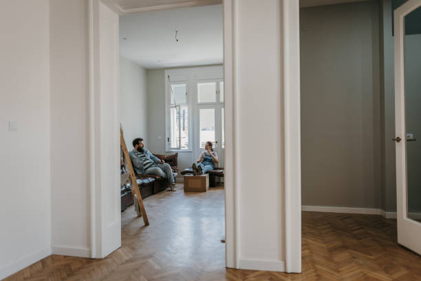 istock Couple relaxing in new home 1392807632