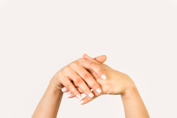 istock Woman hands crossed on a white background 1392807763