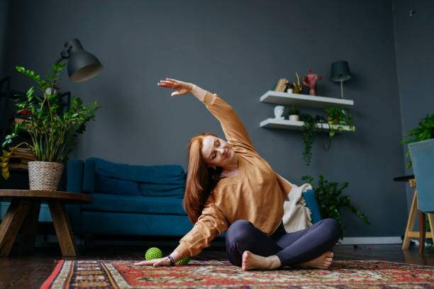 istock a woman does a pilates exercise at home 1392807777