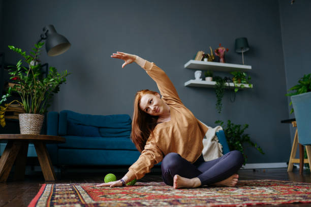 istock a woman does a pilates exercise at home 1392807829