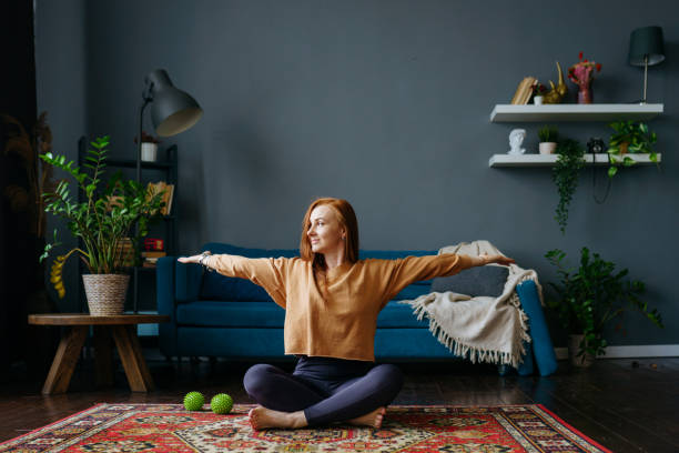 istock a woman does an exercise on the floor 1392807866