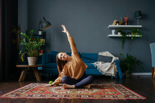 istock a woman does an exercise on the floor 1392807904