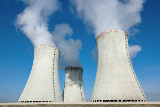 cooling towers of nuclear power plant stock photo