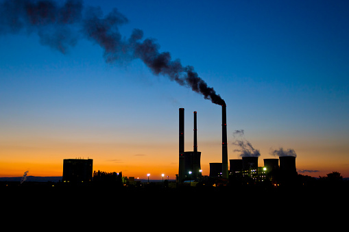 Coal burning power plant under the evening sky