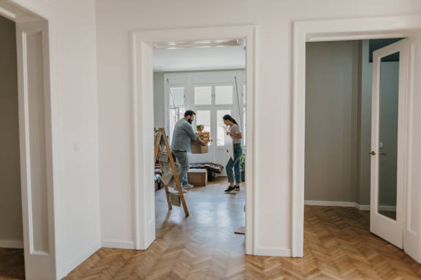 istock Couple moving in new apartment 1392810186