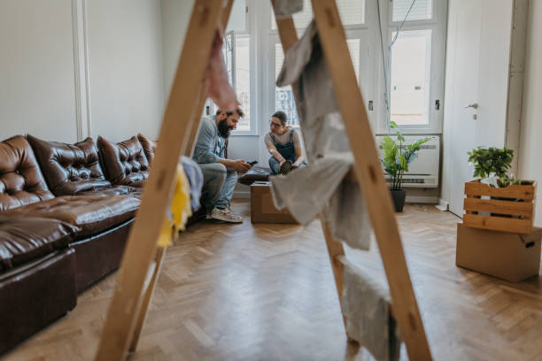 istock Couple sitting in new apartment 1392814470
