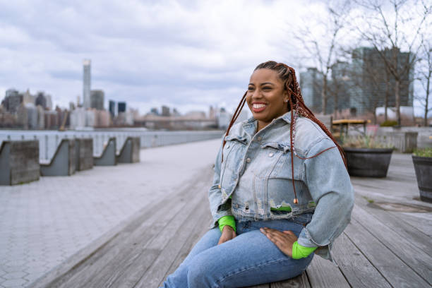 Confident black woman outdoors stock photo