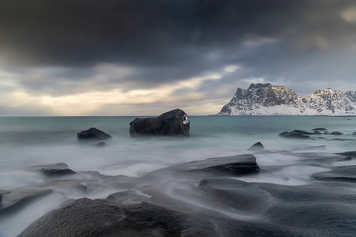 Uttakleiv beach in winter with waves and wind - lofoten islands - Norway