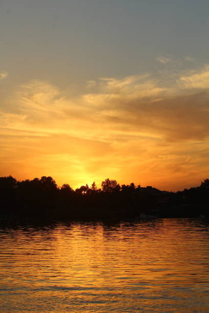 town beach sunset river boat
