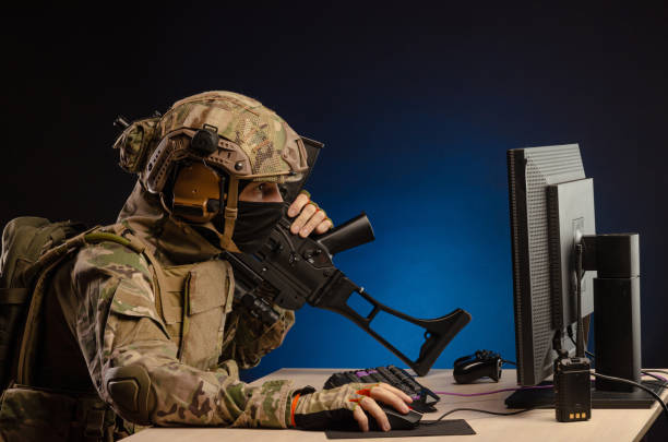 istock soldier sitting at a computer is conducting a cyber war 1392824390