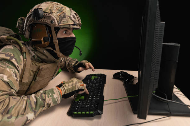 istock a military soldier at a computer is conducting a cyber war 1392824393