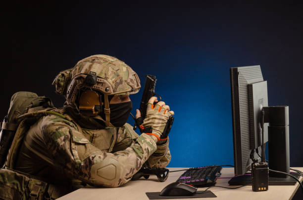 istock soldier sitting at a computer is conducting a cyber war 1392824407