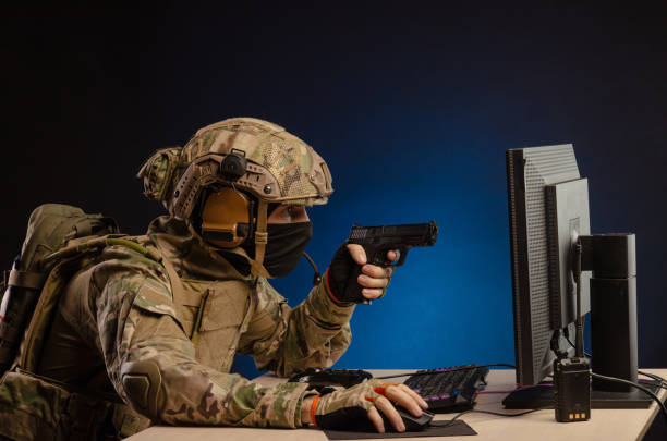 istock soldier sitting at a computer is conducting a cyber war 1392824409