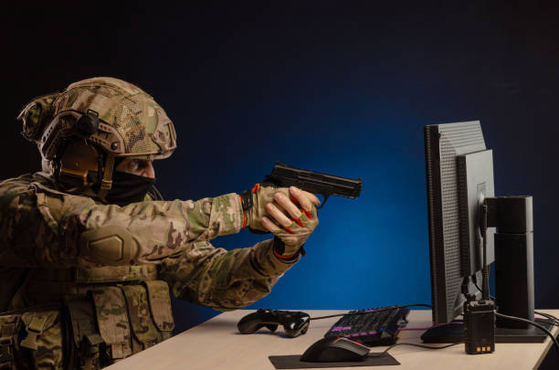 istock soldier sitting at a computer is conducting a cyber war 1392824411